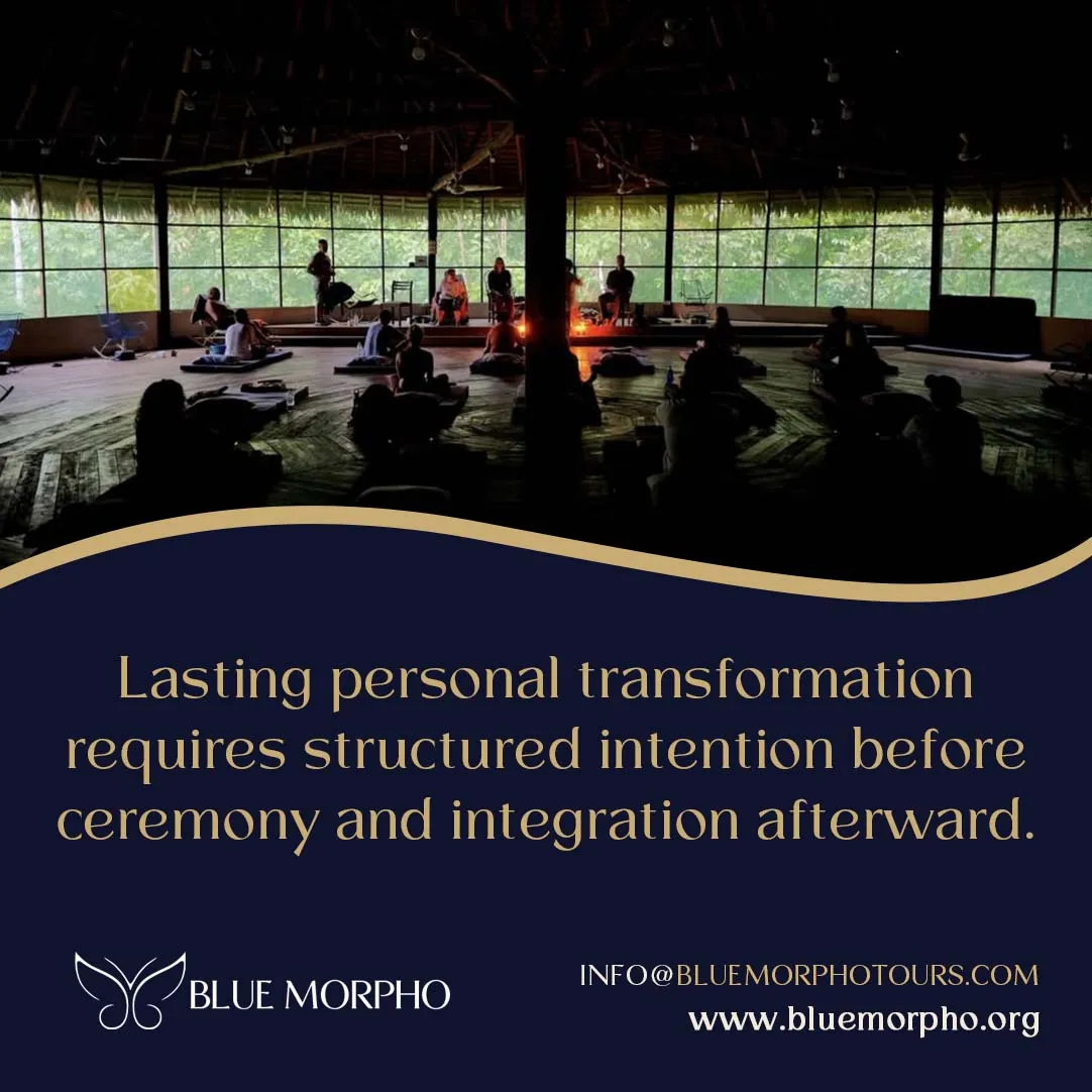 Dimly lit round ceremony hall with participants on mats and jungle visible through the windows at a retreat